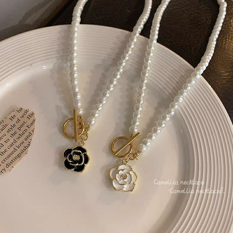 Gold Plated Flower Shaped Pendant with Black and White Beads